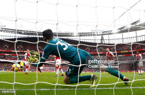 Petr Cech of Arsenal makes a save during the Premier League match between Arsenal and Watford at Emirates Stadium on March 11, 2018 in London,...