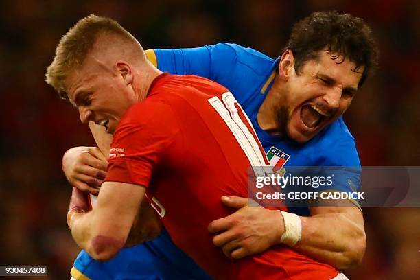 Wales' fly-half Gareth Anscombe is tackled by Italy's lock Alessandro Zanni during the Six Nations international rugby union match between Wales and...