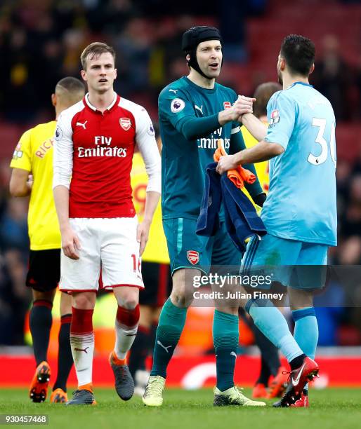 Petr Cech of Arsenal embraces Orestis Karnezis of Wartford after the Premier League match between Arsenal and Watford at Emirates Stadium on March...