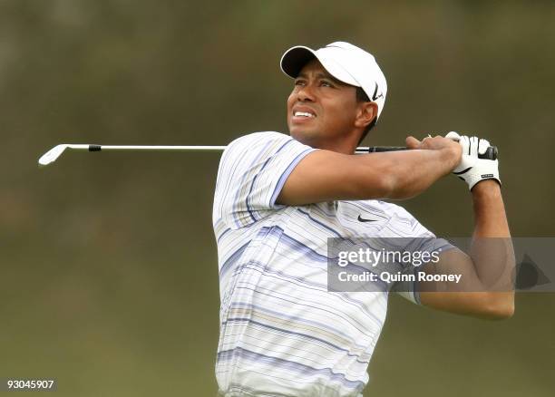 Tiger Woods of the USA plays an approach shot on the 4th hole during round three of the 2009 Australian Masters at Kingston Heath Golf Club on...