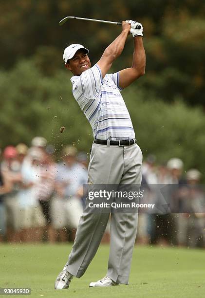 Tiger Woods of the USA plays an approach shot on the 3rd hole during round three of the 2009 Australian Masters at Kingston Heath Golf Club on...