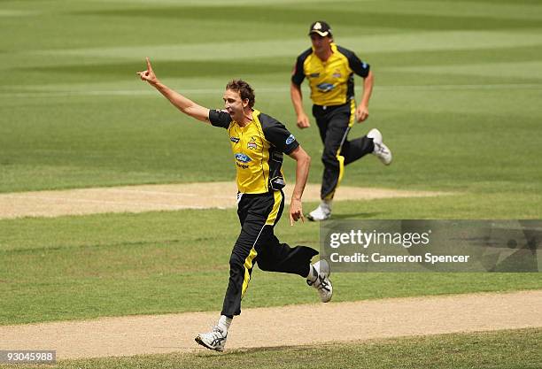 Brett Dorey of the Warriors celebrates taking the wicket of Robert Quiney of the Bushrangers during the Ford Ranger Cup match between the Victoria...
