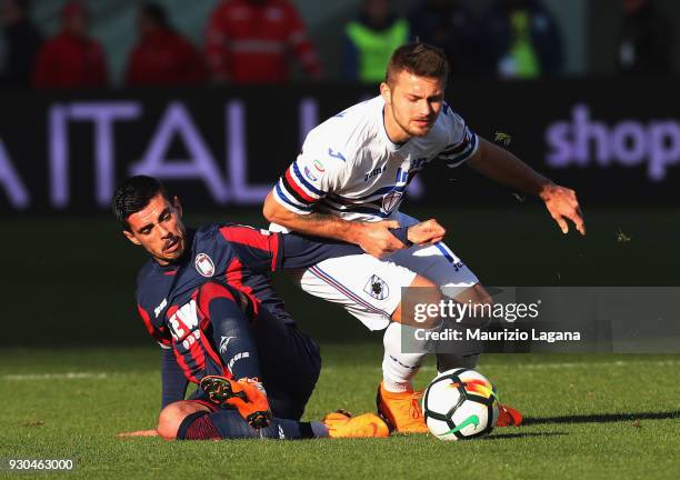 Adrian Stoian of Crotone competes for the ball with Karol Linetty of Sampdoria during the serie A match between FC Crotone and UC Sampdoria at Stadio...