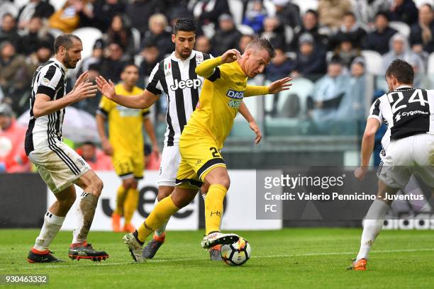 Sami Khedira of Juventus competes for the ball with Maxi Lopez of Udinese Calcio during the serie A match between Juventus and Udinese Calcio on...