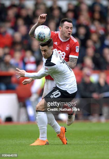 Lee Tomlin of Nottingham Forest and Tom Lawrence of Derby County in action during the Sky Bet Championship match between Nottingham Forest and Derby...