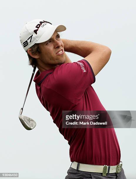 Aaron Baddeley of Australia plays an approach shot on the 1st hole during round three of the 2009 Australian Masters at Kingston Heath Golf Club on...