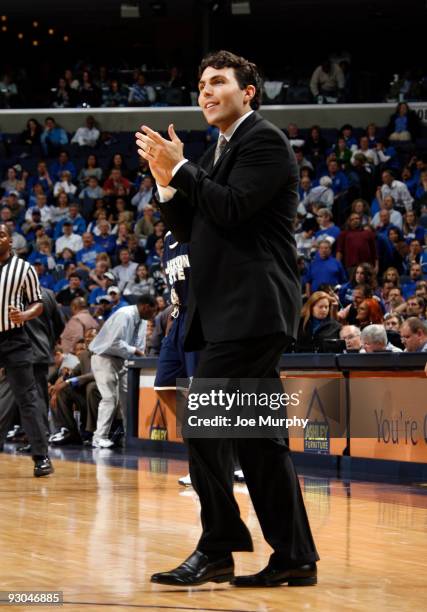 Josh Pastner, head coach of the Memphis Tigers cheers on his team against the Jackson State Tigers on November 13, 2009 at FedexForum in Memphis,...