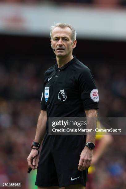 Referee Martin Atkinson during the Premier League match between Arsenal and Watford at Emirates Stadium on March 11, 2018 in London, England.