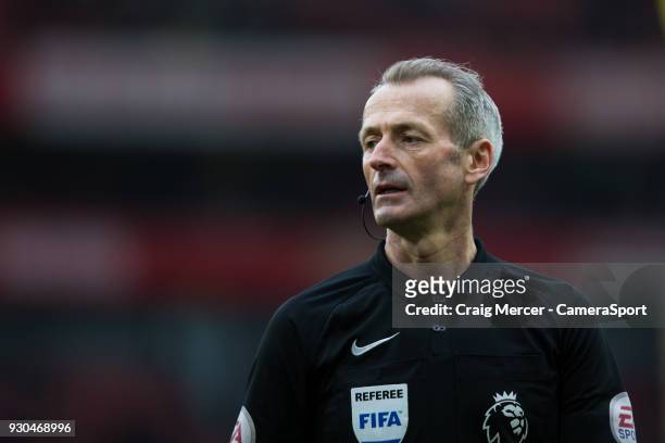 Referee Martin Atkinson during the Premier League match between Arsenal and Watford at Emirates Stadium on March 11, 2018 in London, England.
