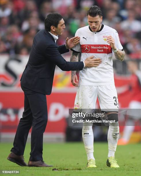 Head coach Tayfun Korkut of Stuttgart talks to Daniel Ginczek during the Bundesliga match between VfB Stuttgart and RB Leipzig at Mercedes-Benz Arena...