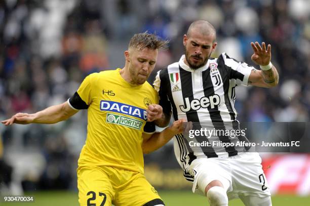 Stefano Sturaro of Juventus competes for the ball with Silvan Widmer of Udinese Calcio during the serie A match between Juventus and Udinese Calcio...