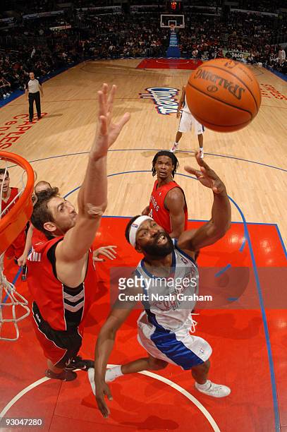 Baron Davis of the Los Angeles Clippers puts up a shot against Andrea Bargnani of the Toronto Raptors at Staples Center on November 13, 2009 in Los...