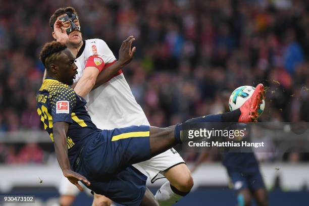 Jean-Kevin Augustin of Leipzig tries to score under pressure from Christian Gentner of Stuttgart during the Bundesliga match between VfB Stuttgart...