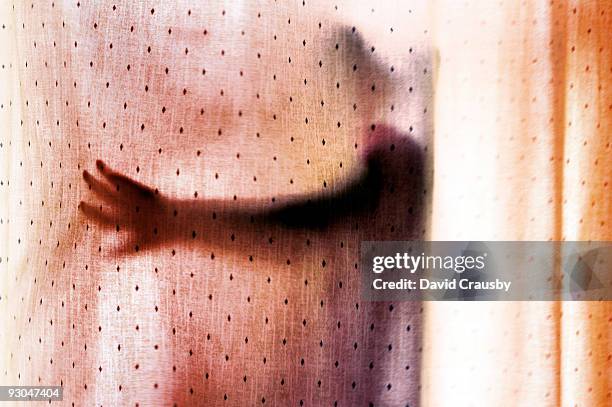 figure behind curtains - crausby stockfoto's en -beelden