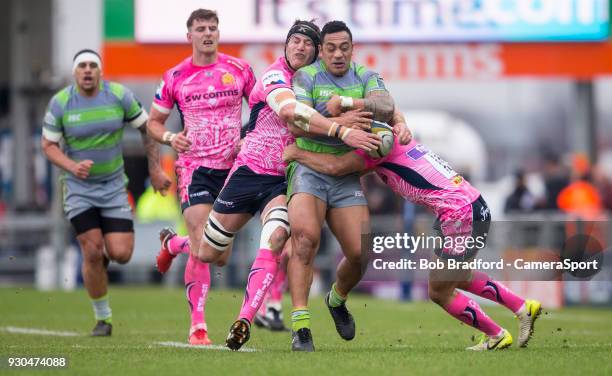 Newcastle Falcons' Sinoti Sinoti is tackled by Exeter Cheifs' Mitch Lees during the Anglo Welsh Cup Semi Final match between Exeter Chiefs and...