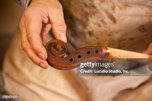 String instrument maker and a scroll String instrument maker and a scroll