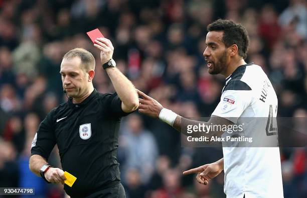 Tom Huddleston of Derby County is shown a red card during the Sky Bet Championship match between Nottingham Forest and Derby County at City Ground on...