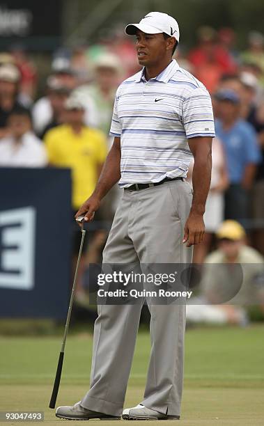 Tiger Woods of the USA reacts after a putt on the 17th hole during round three of the 2009 Australian Masters at Kingston Heath Golf Club on November...