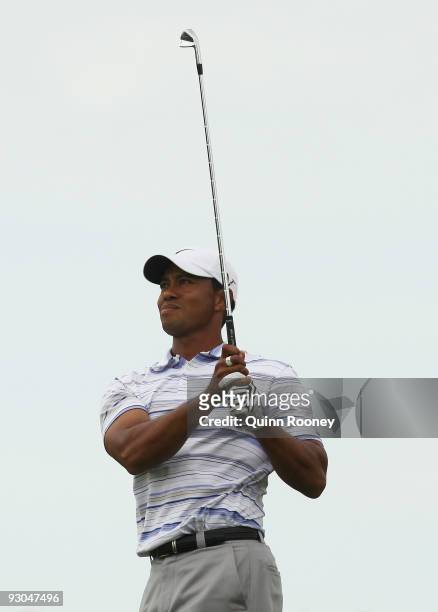 Tiger Woods of the USA plays an approach shot on the 16th hole during round three of the 2009 Australian Masters at Kingston Heath Golf Club on...