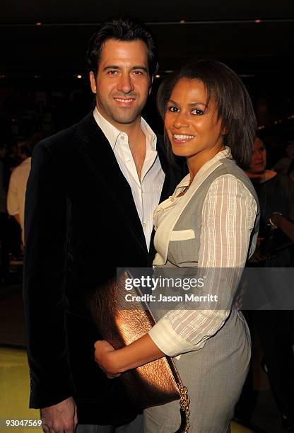 Actor Troy Garity and Simone Bent attend the Prada book launch cocktail held at Prada Rodeo Drive on November 13, 2009 in Beverly Hills, California.