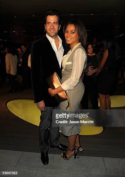 Actor Troy Garity and Simone Bent attend the Prada book launch cocktail held at Prada Rodeo Drive on November 13, 2009 in Beverly Hills, California.
