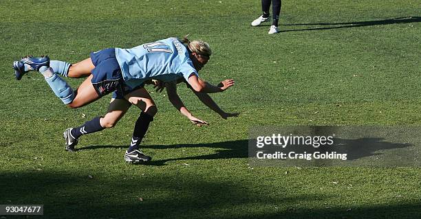 Catherine Paaske of Sydney falls over Leia Smith of the Jets during the round seven W-League match between Sydney FC and the Newcastle Jets at...