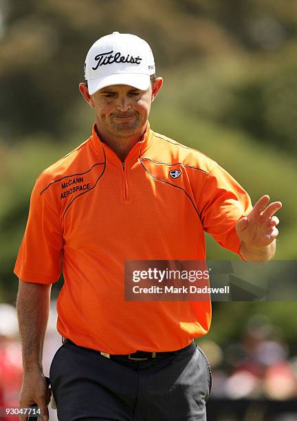 Greg Chalmers of New Zealand acknowledges the crowd after making a putt on the 10th hole during round three of the 2009 Australian Masters at...