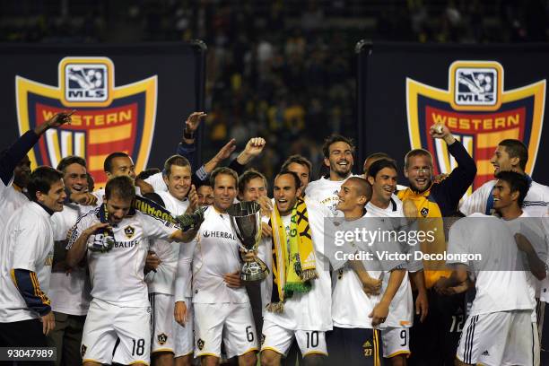 Captain Landon Donovan of the Los Angeles Galaxy and his teammates celebrate on the podium with the MLS Western Conference Trophy after defeating the...