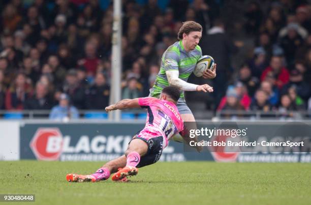 Newcastle Falcons' Simon Hammersley evades the tackle of Exeter Cheifs' Tom O'Flaherty during the Anglo Welsh Cup Semi Final match between Exeter...
