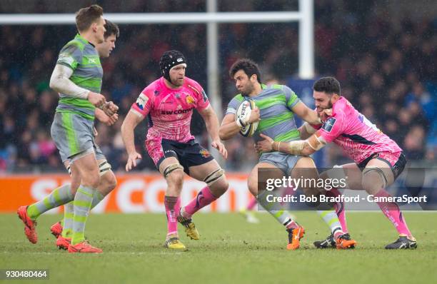 Newcastle Falcons' Maxime Mermoz is tackled by Exeter Cheifs' Dave Dennis during the Anglo Welsh Cup Semi Final match between Exeter Chiefs and...