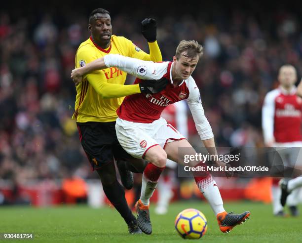 Stefano Okaka of Watford and Rob Holding of Arsenal during the Premier League match between Arsenal and Watford at Emirates Stadium on March 11, 2018...