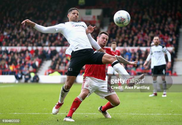 Curtis Davis of Derby county holds off Lee Tomlin of Nottingham Forest during the Sky Bet Championship match between Nottingham Forest and Derby...
