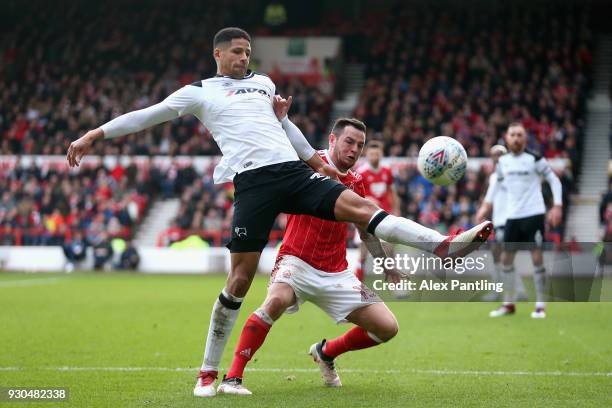 Curtis Davis of Derby county holds off Lee Tomlin of Nottingham Forest during the Sky Bet Championship match between Nottingham Forest and Derby...