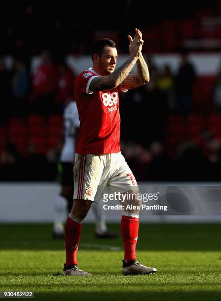 Lee Tomlin of Nottingham Forest applauds fans following the Sky Bet Championship match between Nottingham Forest and Derby County at City Ground on...