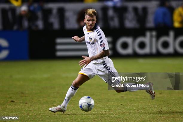 David Beckham of the Los Angeles Galaxy attacks the defense of the Houston Dynamo during their MLS Western Conference Championship game at The Home...