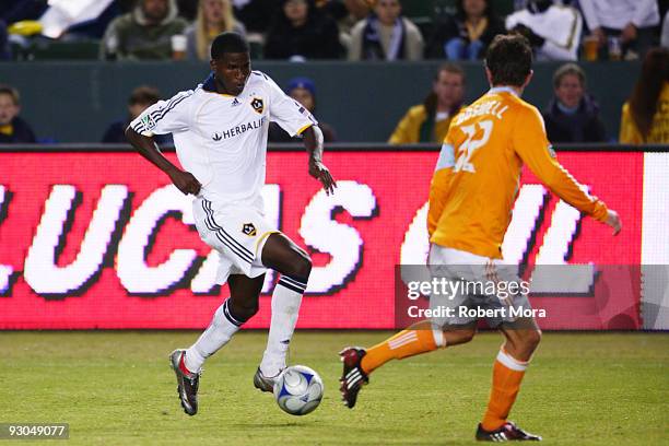 Edson Buddle of the Los Angeles Galaxy attacks the defense of the Houston Dynamo during their MLS Western Conference Championship game at The Home...