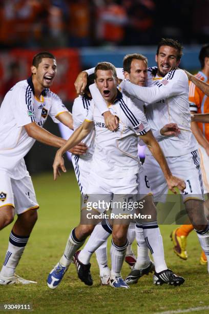 Gregg Berhalter of the Los Angeles Galaxy celebrates scoring the go ahead goal with teammates against the Houston Dynamo during their MLS Western...
