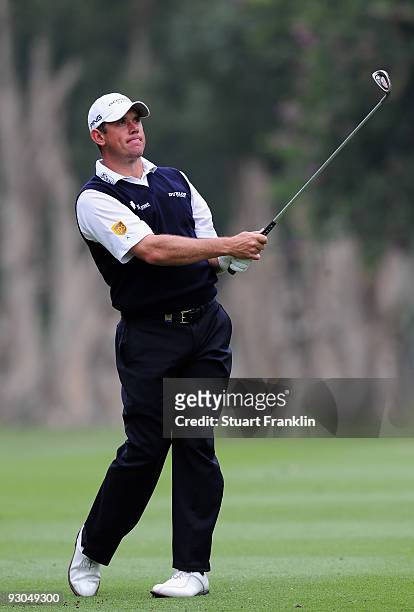 Lee Westwood of England plays his approach shot on the sixth hole during the third round of the UBS Hong Kong Open at the Hong Kong Golf Club on...