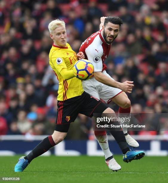 Sead Kolasinac of Arsenal challenges Will Hughes of Watford during the Premier League match between Arsenal and Watford at Emirates Stadium on March...