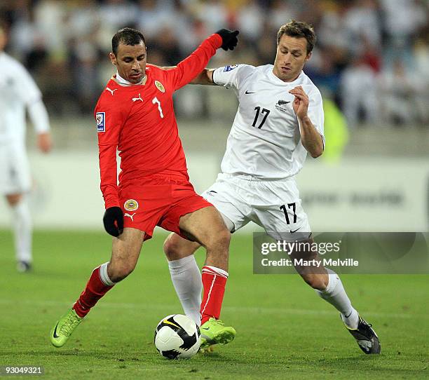 Andrew Barron of the All Whites gets tackled by Sayed Mahmood Jala of Bahrain during the 2010 FIFA World Cup Asian Qualifier match between New...