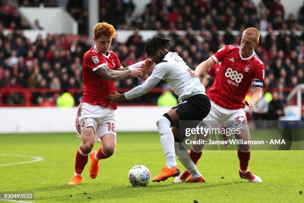 Jack Colback of Nottingham Forest and Kasey Palmer of Derby County and Ben Watson of Nottingham Forest during the Sky Bet Championship match between...