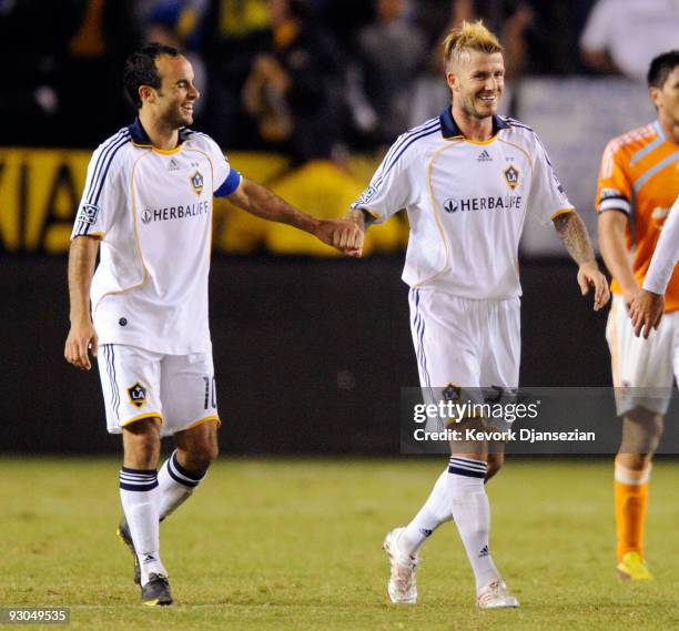 David Beckham and Landon Donovan of the Los Angeles Galaxy celebrate after teammate Gregg Belhalter's goal against Houston Dynamo during the MLS...