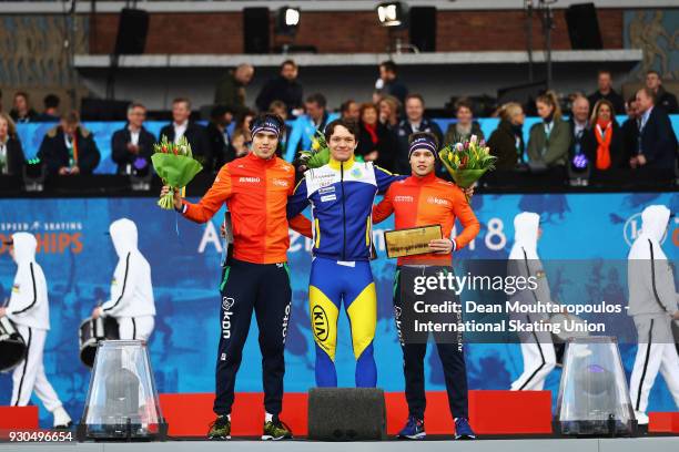 Patrick Roest of the Netherlands , Nils Van Der Poel of Sweden and Marcel Bosker of the Netherlands celebrate on the podium for the 10000m Mens race...