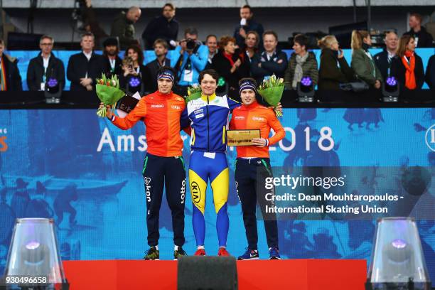Patrick Roest of the Netherlands , Nils Van Der Poel of Sweden and Marcel Bosker of the Netherlands celebrate on the podium for the 10000m Mens race...