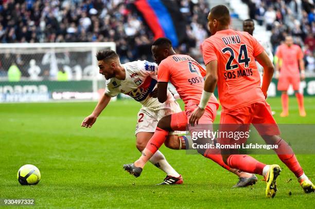 Jordan Ferri of Lyon, Ismael Diomande and Alexander Djiku of Caen during the Ligue 1 match between Olympique Lyonnais and SM Caen at Parc Olympique...