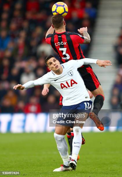 Steve Cook of AFC Bournemouth wins a header over Erik Lamela of Tottenham Hotspur during the Premier League match between AFC Bournemouth and...