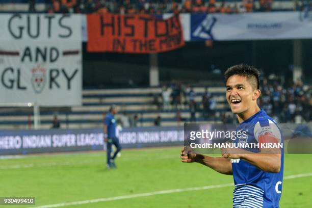 Indian club Bengaluru FC player Sunil Chhetri acknowledges the crowds after the team's 3-1 win against Pune City in the Hero ISL semi finals match at...