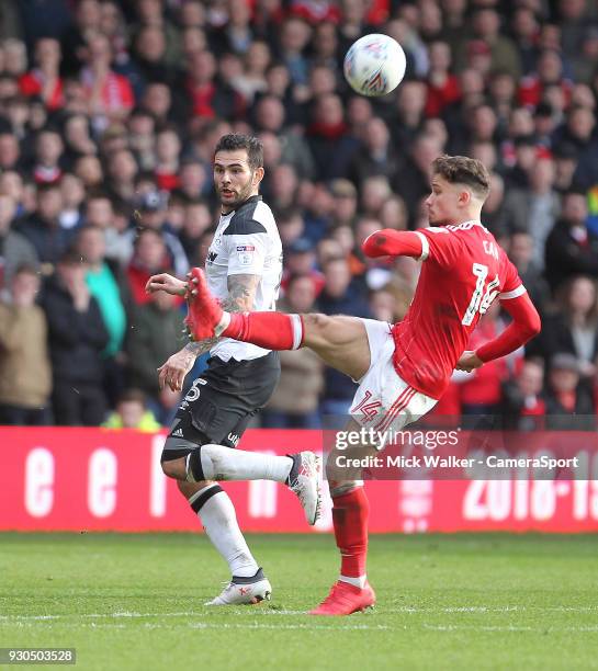 Nottingham Forest's Matty Cash in action with Derby County's Bradley Johnson during the Sky Bet Championship match between Nottingham Forest and...