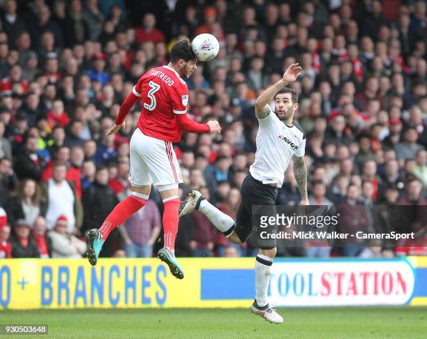 Nottingham Forest's Tobias Figueiredo in action with Derby County's Bradley Johnson during the Sky Bet Championship match between Nottingham Forest...
