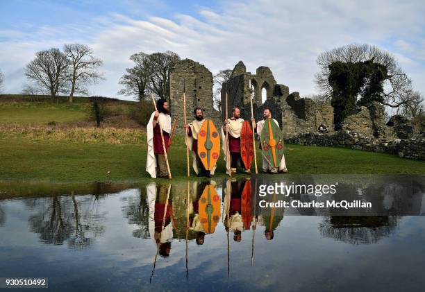 Members of the Magnus Viking association take part in the re-enactment of Saint Patrick's first landing in Ireland at Inch Abbey on March 11, 2018 in...
